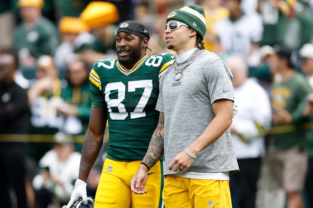 GREEN BAY, WISCONSIN - SEPTEMBER 07: Romeo Doubs #87 and Christian Watson #9 of the Green Bay Packers look on prior to a game against the Detroit Lions at Lambeau Field on September 07, 2025 in Green Bay, Wisconsin. (Photo by John Fisher/Getty Images)