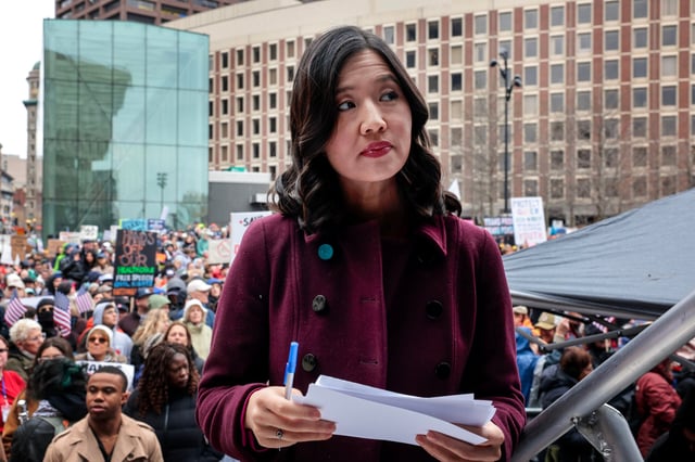 Boston Mayor Michelle Wu prepared to make remarks during ‘Hands Off,’ an anti-Trump/Musk rally at City Hall Plaza in April.
