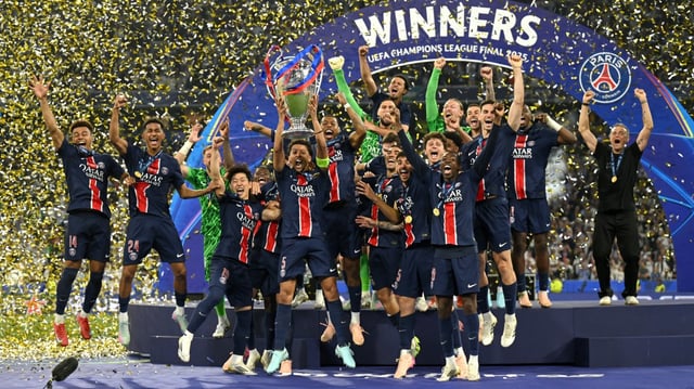Paris Saint-Germain players celebrate with the Champions League trophy after thrashing Inter 5-0 in last May’s final