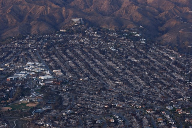 An aerial view of the fire damage caused by the Palisades Fire is shown in the Pacific Palisades, California, U.S. January 22, 2025.  REUTERS/Mike Blake