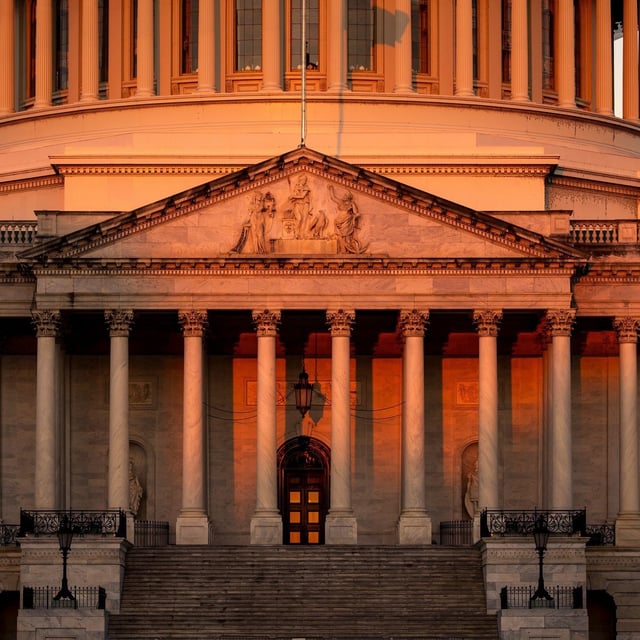 The Capitol is illuminated at dawn on the 6th day of the government shutdown, at the Capitol in Washington, Monday, Oct. 6, 2025. (AP Photo/J. Scott Applewhite)