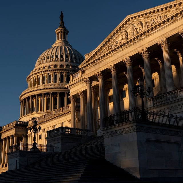The Senate side of the Capitol is illuminated by the sun at dawn in Washington, Monday, Oct. 6, 2025. (AP Photo/J. Scott Applewhite)
