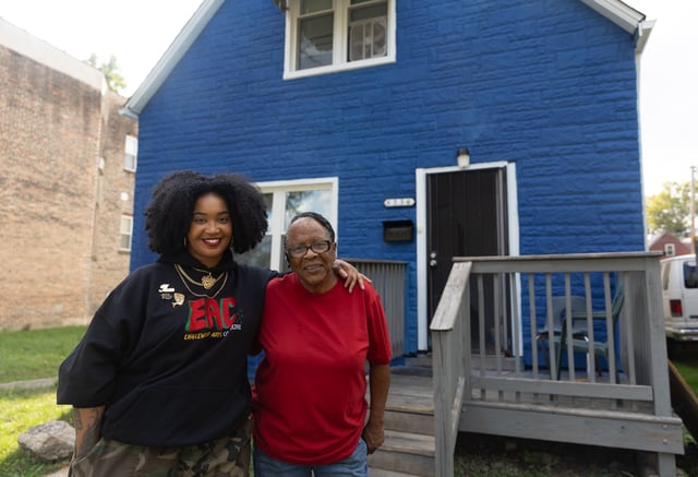 Artist Tonika Lewis Johnson and local resident Justine Stephens, right, stand for portrait in the 6500-block of South Aberdeen Street in Chicago's Englewood neighborhood, on Monday, Oct. 6, 2025. (AP Photo/Talia Sprague)