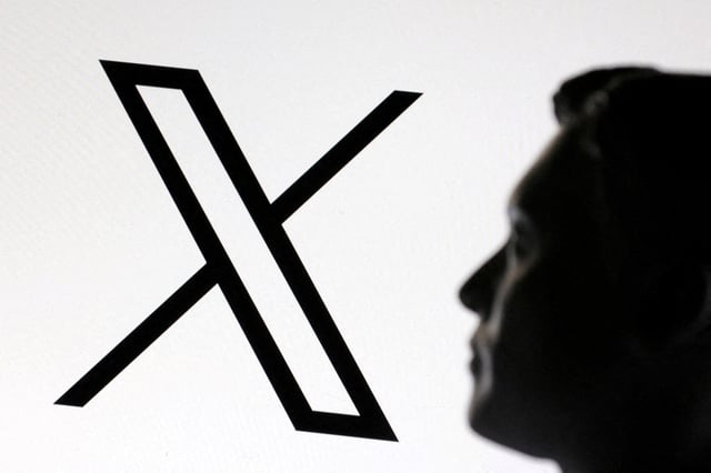 A 3D-printed miniature model of Elon Musk and the X logo are seen in this illustration taken January 23, 2025. REUTERS/Dado Ruvic/Illustration/File Photo