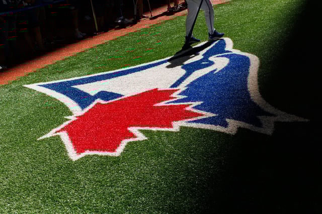 TORONTO, CANADA - JULY 26: The Toronto Blue Jays logo is seen during warms up ahead of the game against the Texas Rangers at Rogers Centre on July 26, 2024 in Toronto, Canada. (Photo by Cole Burston/Getty Images)