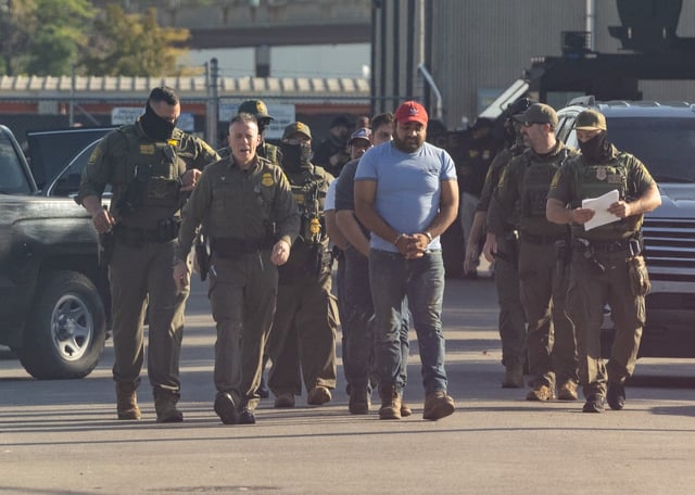 U.S. Border Patrol Chief Greg Bovino leads detainees into the Immigration and Customs Enforcement facility in Broadview on Sept. 27, 2025. (Dominic Di Palermo/Chicago Tribune)