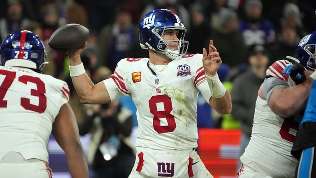 Nov 10, 2024; Munich, Germany; New York Giants quarterback Daniel Jones (8) throws the ball against the Carolina Panthers in the second half during the 2024 NFL Munich Game at Allianz Arena. Mandatory Credit: Kirby Lee-Imagn Images