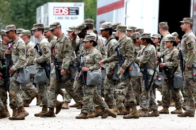 Members of the Texas National Guard assemble at the Army Reserve Training Center in Elwood, Illinois,  on October 7.