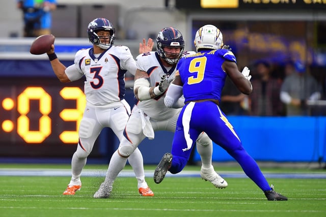 Dec 10, 2023; Inglewood, California, USA; Denver Broncos quarterback Russell Wilson (3) throws as guard Ben Powers (74) provides coverage against Los Angeles Chargers linebacker Kenneth Murray Jr. (9) during the first half at SoFi Stadium. Mandatory Credit: Gary A. Vasquez-USA TODAY Sports