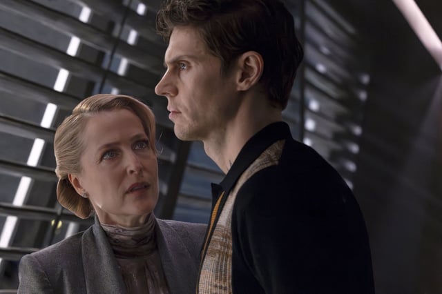 Gillian Anderson, left, and Evan Peters in a scene from “Tron: Ares.”