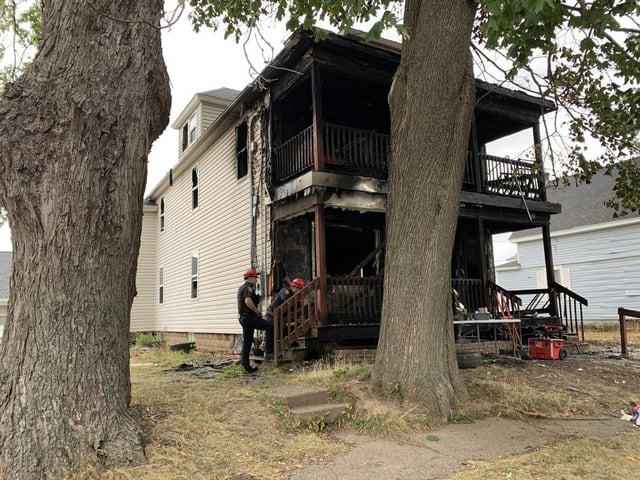  The Moncton Fire Department is investigating the cause of a fire that resulted in two people being rescued and two firefighters being treated for minor injuries Wednesday morning.