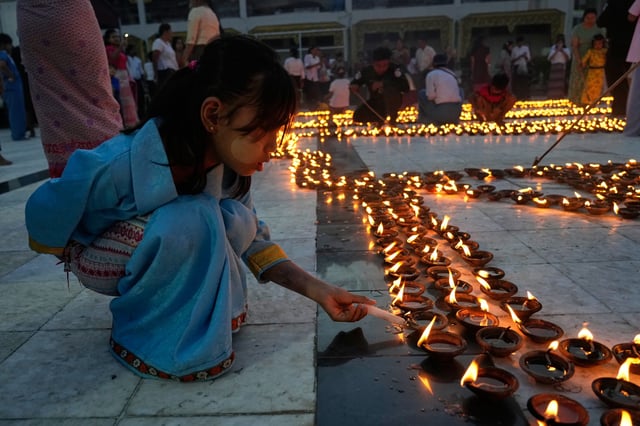 Buddhist devotees light oil lamps at Botataung pagoda during celebrations of the full moon day of Thadingyut, in Yangon, Myanmar, Oct. 6, 2025 (AP photo by Thein Zaw).