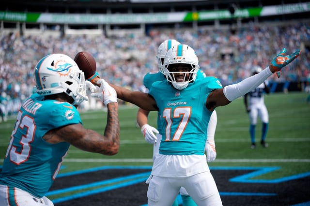 Dolphins receiver Jaylen Waddle celebrates after scoring against Panthers on Sunday, Oct. 5, 2025, in Charlotte, N.C. (AP Photo/Jacob Kupferman)