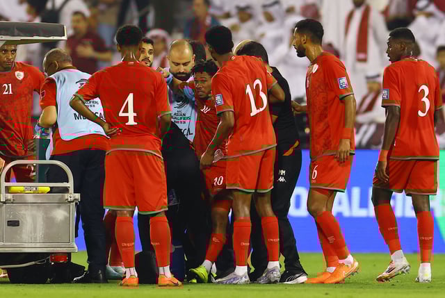 Soccer Football - FIFA World Cup - AFC Qualifiers - Group A - Oman v Qatar - Jassim Bin Hamad Stadium, Doha, Qatar - October 8, 2025 Oman's Jameel Al-Yahmadi receives medical attention after sustaining an injury REUTERS/Ibraheem Al Omari