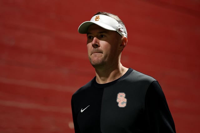 LOS ANGELES, CALIFORNIA - SEPTEMBER 20: Head coach Lincoln Riley of the USC Trojans walks out of the tunnel before the game against the Michigan State Spartans at Los Angeles Memorial Coliseum on September 20, 2025 in Los Angeles, California. (Photo by Luke Hales/Getty Images)