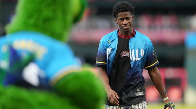 Aug 29, 2025; Philadelphia, Pennsylvania, USA; Philadelphia 76ers draft pick V.J. Edgecombe looks on after performing a ceremonial pitch before the game between the Philadelphia Phillies and the Atlanta Braves at Citizens Bank Park. Mandatory Credit: Kyle Ross-Imagn Images