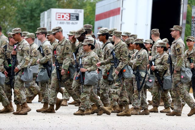 Members of the Texas National Guard assemble in Elwood, Illinois, at the Army Reserve Training Center in the southwest suburb of Chicago, on Tuesday, Oct. 7. 2025.
