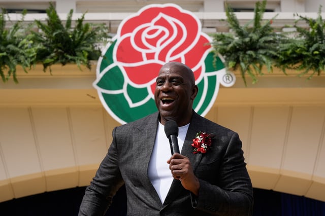 Basketball Hall of Famer Earvin "Magic" Johnson speaks after he was introduced as the grand marshal for the 137th Rose Parade, Wednesday, Oct. 8, 2025, in Pasadena, Calif. (AP Photo/Damian Dovarganes)