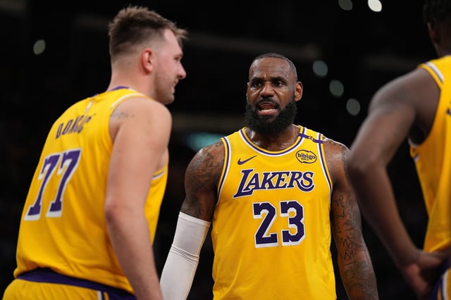 LOS ANGELES, CALIFORNIA - APRIL 03: LeBron James #23 of the Los Angeles Lakers reacts to his teammate Luka Doncic #77 during the first half of a game against the Golden State Warriors at Crypto.com Arena on April 03, 2025 in Los Angeles, California. NOTE TO USER: User expressly acknowledges and agrees that, by downloading and or using this photograph, User is consenting to the terms and conditions of the Getty Images License Agreement. (Photo by Michael Owens/Getty Images)