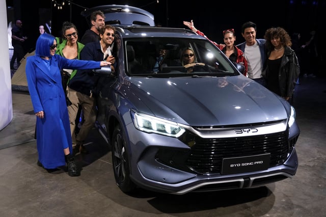 Influencers pose for a photo at the launch event of Chinese electric vehicle (EV) maker BYD in Buenos Aires, Argentina, October 8, 2025. REUTERS/Alessia Maccioni