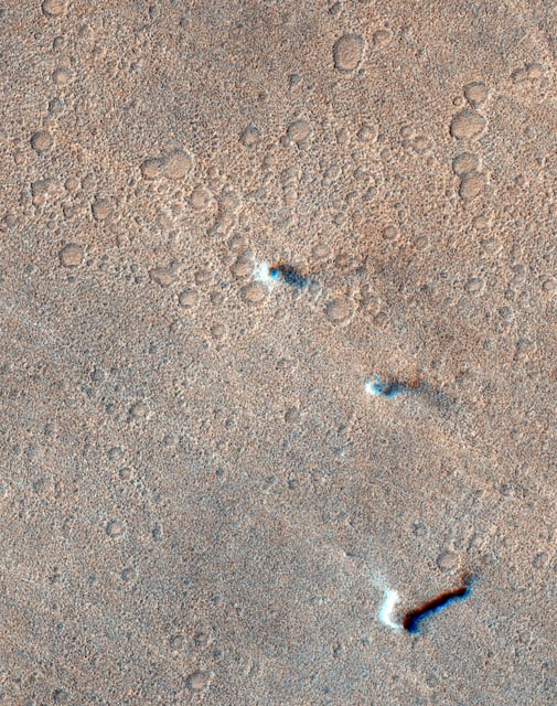 ExoMars Trace Gas Orbiter captured three dust devils tracking across the Martian surface on November 8, 2021.