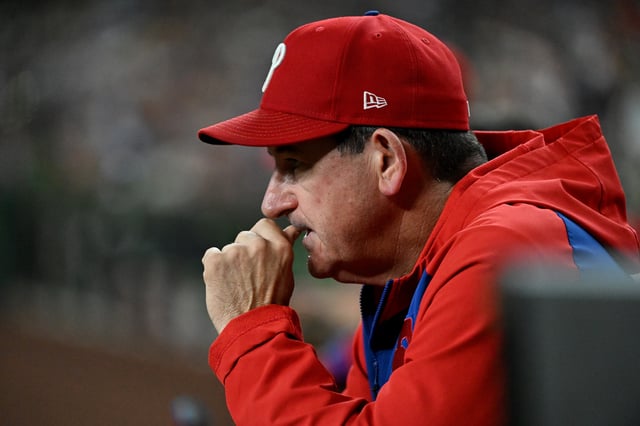 PHOENIX, ARIZONA - SEPTEMBER 20: Manager Rob Thomson #49 of the Philadelphia Phillies looks on during the seventh inning against the Arizona Diamondbacks at Chase Field on September 20, 2025 in Phoenix, Arizona. Diamondbacks won 4-3. (Photo by Norm Hall/Getty Images)
