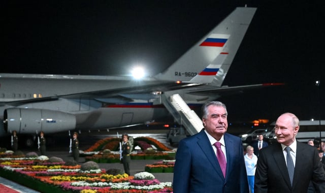 Tajik President Emomali Rahmon welcomes Russian President Vladimir Putin during his arrival at the Dushanbe International Airport in Dushanbe, Tajikistan October 8, 2025. Sputnik/Kristina Kormilitsyna/Pool via REUTERS