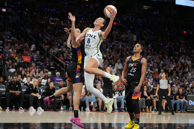 Sep 28, 2025; Phoenix, Arizona, USA; Minnesota Lynx forward Alanna Smith (8) scores on Phoenix Mercury forward Kathryn Westbeld (24) and forward Alyssa Thomas (25) in the second half during game four of the second round for the 2025 WNBA Playoffs at PHX Arena. Mandatory Credit: Rick Scuteri-Imagn Images/ File Photo