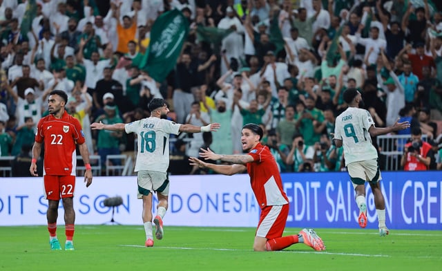 Soccer Football - FIFA World Cup - AFC Qualifiers - Group B - Indonesia v Saudi Arabia - King Abdullah Sports City, Jeddah, Saudi Arabia - October 8, 2025 Saudi Arabia's Feras Al-Brikan celebrates scoring their third goal with Saudi Arabia's Waheb Saleh REUTERS/Stringer