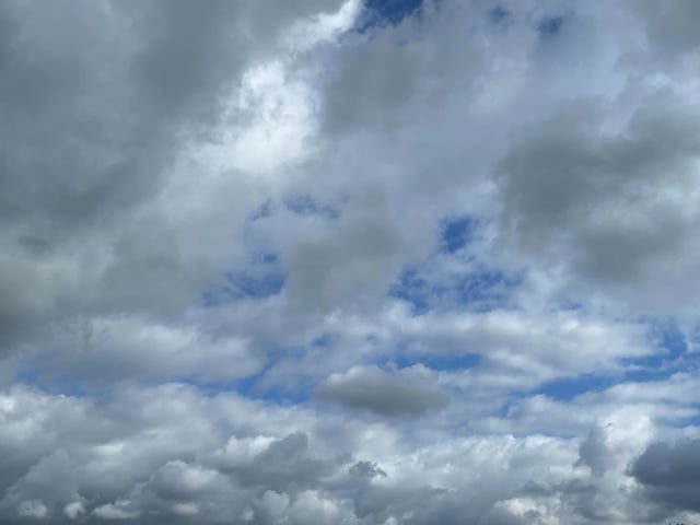 Sunshine peaks through mostly cloudy skies over NBC 7’s Kearny Mesa Studios on Dec. 23, 2023. (NBC 7)