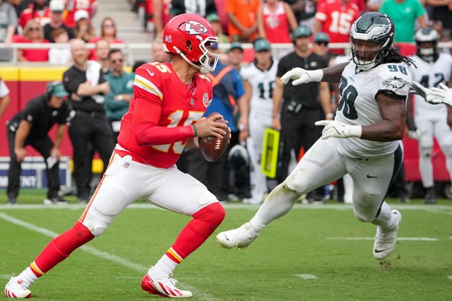 Sep 14, 2025; Kansas City, Missouri, USA; Philadelphia Eagles defensive tackle Jalen Carter (98) puts pressure on Kansas City Chiefs quarterback Patrick Mahomes (15) during the third quarter of the game at GEHA Field at Arrowhead Stadium. Mandatory Credit: Denny Medley-Imagn Images/ File Photo