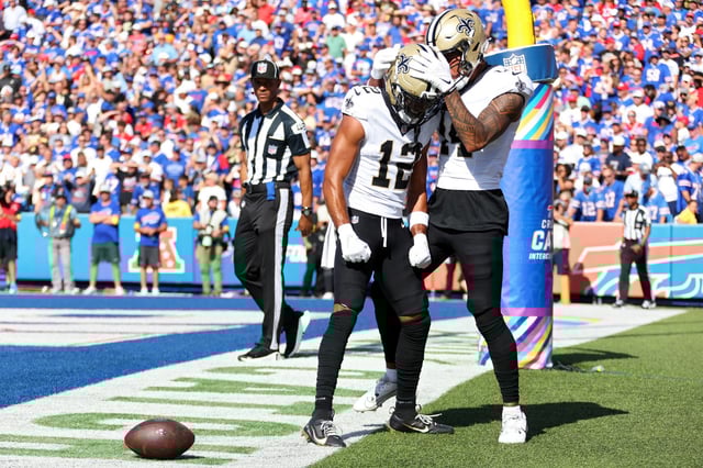 ORCHARD PARK, NEW YORK - SEPTEMBER 28: Chris Olave #12 of the New Orleans Saints celebrates a touchdown with Devaughn Vele #14 during the third quarter against the Buffalo Bills at Highmark Stadium on September 28, 2025 in Orchard Park, New York. (Photo by Timothy T Ludwig/Getty Images)