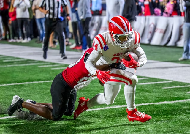 Mater Dei running back Asir Nembhard drags Orange Lutheran free safety Chauncey Washington II as he crosses the goal line to score a touchdown in a Trinity League football game in Costa Mesa on Friday, Oct. 3, 2025. (Photo by Paul Rodriguez, Contributing Photographer)