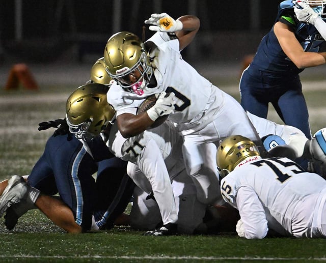 San Juan Hills Elijah Ayala (0) dives for a first down in the first quarter of a Friday night football game against Corona del Mar, Oct. 3, 2025, at Newport Harbor High. (Photo by Steven Georges, Contributing Photographer)