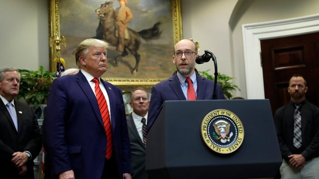 President Trump and Russell Vought speak during the continuing government shutdown