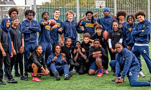 Members of the St. Thomas Aquinas football team ran a youth football clinic on Tuesday as part of their successful trip to London. The Raiders defeated the NFL Academy on Wednesday evening 41-38 at Tottenham Hotspur Stadium to culminate their trip. (Samantha Balanovich, Sam B. Photography/Courtesy)