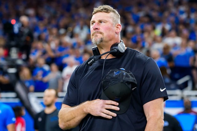DETROIT, MICHIGAN - SEPTEMBER 14: Dan Campbell of the Detroit Lions stands for the National Anthem prior to an NFL football game against the Cleveland Browns at Ford Field on September 28, 2025 in Detroit, Michigan. (Photo by Todd Rosenberg/Getty Images)