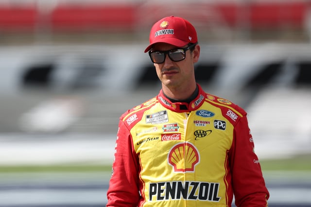 CONCORD, NORTH CAROLINA - OCTOBER 04: Joey Logano, driver of the #22 Shell Pennzoil Ford, walks the grid during practice for the NASCAR Cup Series Bank of America ROVAL 400 at Charlotte Motor Speedway on October 04, 2025 in Concord, North Carolina. (Photo by Jordan Bank/Getty Images)