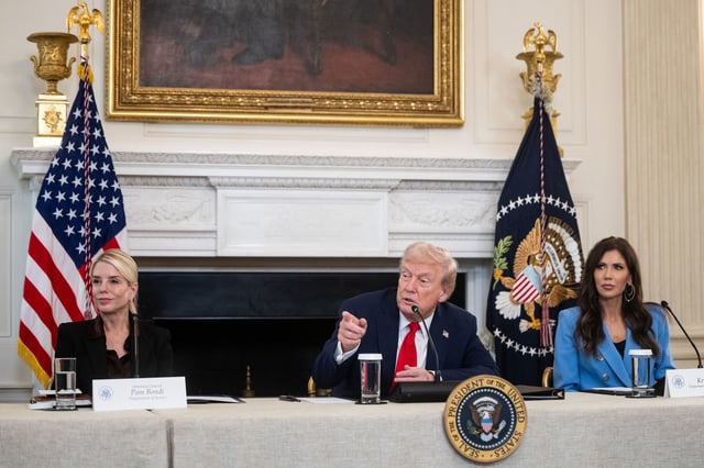 Pam Bondi, US attorney general, from left, US President Donald Trump, and Kristi Noem, secretary of the US Department of Homeland Security (DHS), during a roundtable on Antifa in the State Dining Room of the White House in Washington, DC, US, on Wednesday, Oct. 8, 2025. Trump instructed members of his cabinet to move to declare Antifa a foreign terrorist organization at an event that highlighted his efforts to crack down on the loose collective of far left-wing groups. Photographer: Francis Chung/Politico/Bloomberg via Getty Images