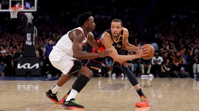 Mar 4, 2025; New York, New York, USA; Golden State Warriors forward Kevin Knox II (31) controls the ball against New York Knicks forward OG Anunoby (8) during the second quarter at Madison Square Garden. Mandatory Credit: Brad Penner-Imagn Images