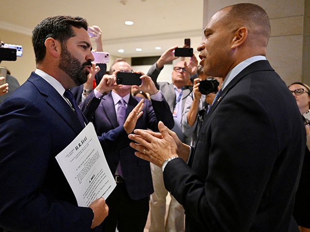Title: Government Shutdown
Image ID: 25281704123946
Article:  Rep. Michael Lawler, R-N.Y., left, confronts House Minority Leader Hakeem Jeffries, D-N.Y., in a heated discussion to endorse House bill H.R.5145 that would extend the American Rescue Plan Act of 2021 (ARPA) and the Inflation Reduction Act of 2022 at the U.S. Capitol on Wednesday, Oct. 8, 2025, in Washington. (AP Photo/John McDonnell)