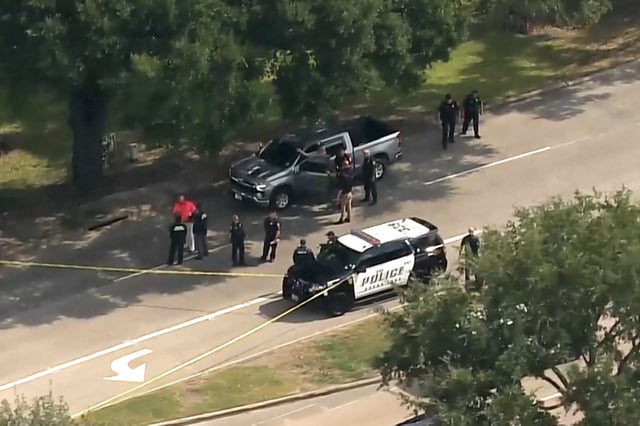 Police investigate a road rage shooting incident in Houston, on Wednesday.