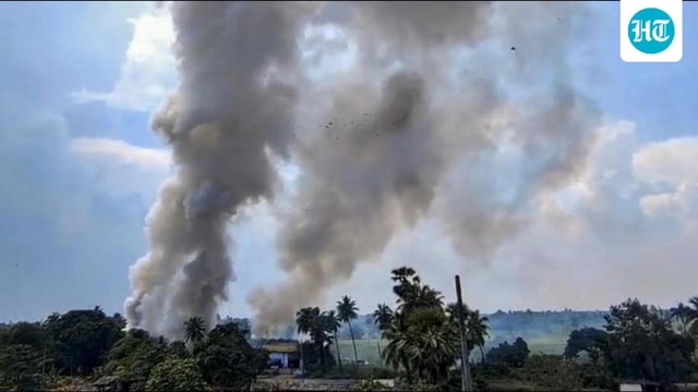 Smoke billows out after a fire accident at a cracker manufacturing unit in the Konaseema district of Andhra Pradesh on Wednesday. (PTI PHOTO)