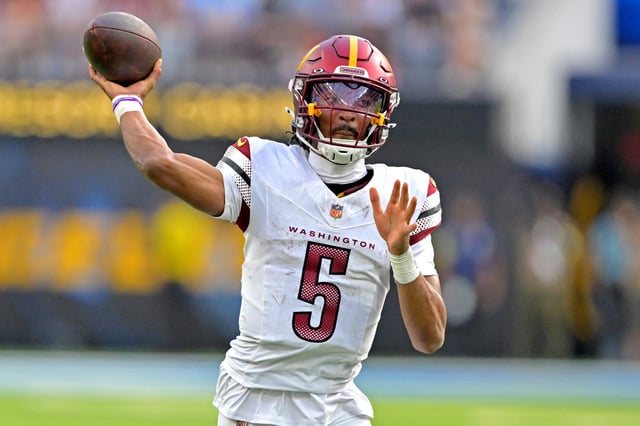 Oct 5, 2025; Inglewood, California, USA; Washington Commanders quarterback Jayden Daniels (5) looks to pass against the Los Angeles Chargers at SoFi Stadium. Mandatory Credit: Jayne Kamin-Oncea-Imagn Images