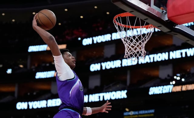 Utah Jazz forward Ace Bailey dunks during the second half of an NBA basketball preseason game against the Houston Rockets in Houston, Wednesday, Oct. 8, 2025. (AP Photo/Ashley Landis)