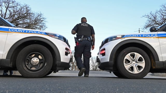 Baltimore County police investigate a shooting scene near Lansdowne High School that left one student dead. (Lloyd Fox/Staff)