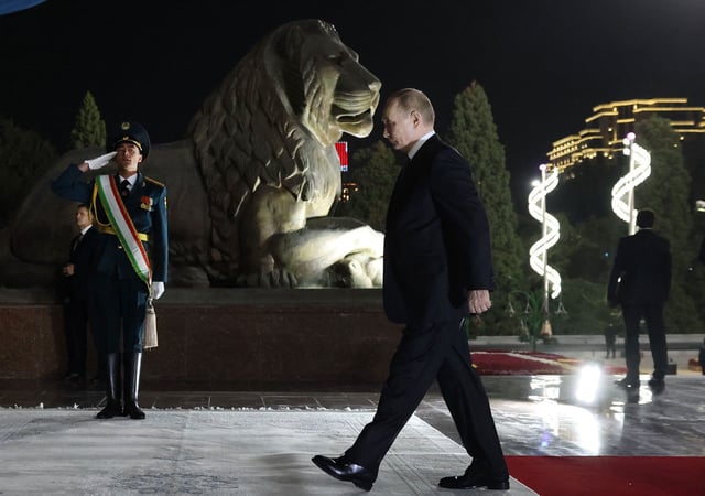 Russian President Vladimir Putin attends a wreath-laying ceremony at the monument of Ismoli Somoni in Dushanbe, Tajikistan, on October 8, 2025.