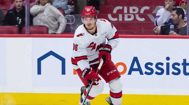 Apr 17, 2025; Ottawa, Ontario, CAN; Carolina Hurricanes center Jack Roslovic (96) skates with the puck in the second period against the Ottawa Senators at the Canadian Tire Centre. Mandatory Credit: Marc DesRosiers-Imagn Images