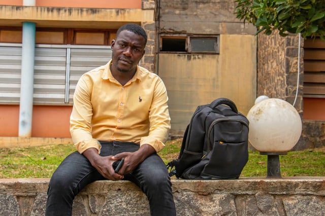 Manoung Gauthier Wilfried, 27, a student, poses on the campus of the University of Yaoundé I, Cameroon, Sept 12, 2025. (AP Photo / Welba Yamo Pascal)