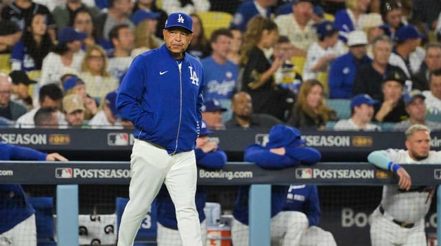 Oct 8, 2025; Los Angeles, California, USA; Los Angeles Dodgers manager Dave Roberts (30) makes a pitching change during the fifth inning against the Philadelphia Phillies during game three of the NLDS round for the 2025 MLB playoffs at Dodger Stadium. Mandatory Credit: Jayne Kamin-Oncea-Imagn Images